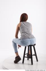 MOLLY SITTING POSE WITH GUN 2